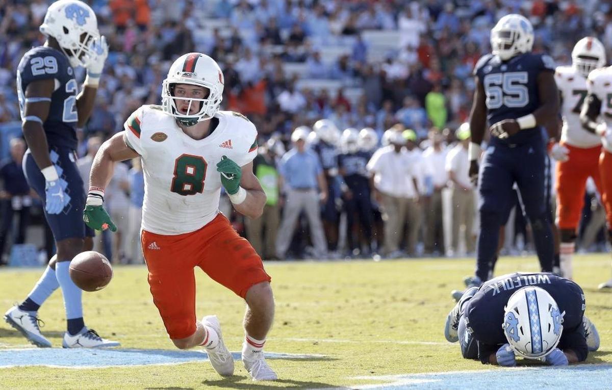 Miami’s Braxton Berrios (8) went to high school in the Triangle, but when it came to making a college choice his heart was in South Florida.