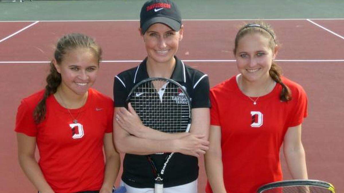 
Davidson women's tennis coach Sara Anundsen, center,is flanked by freshman Ava Todd, left, and junior Elaina Cummer at the Covington Tennis Courts. In Anundsen's first year, Davidson has a 10-7 record (3-2 Atlantic 10) with three matches left before the A-10 Championships. 
