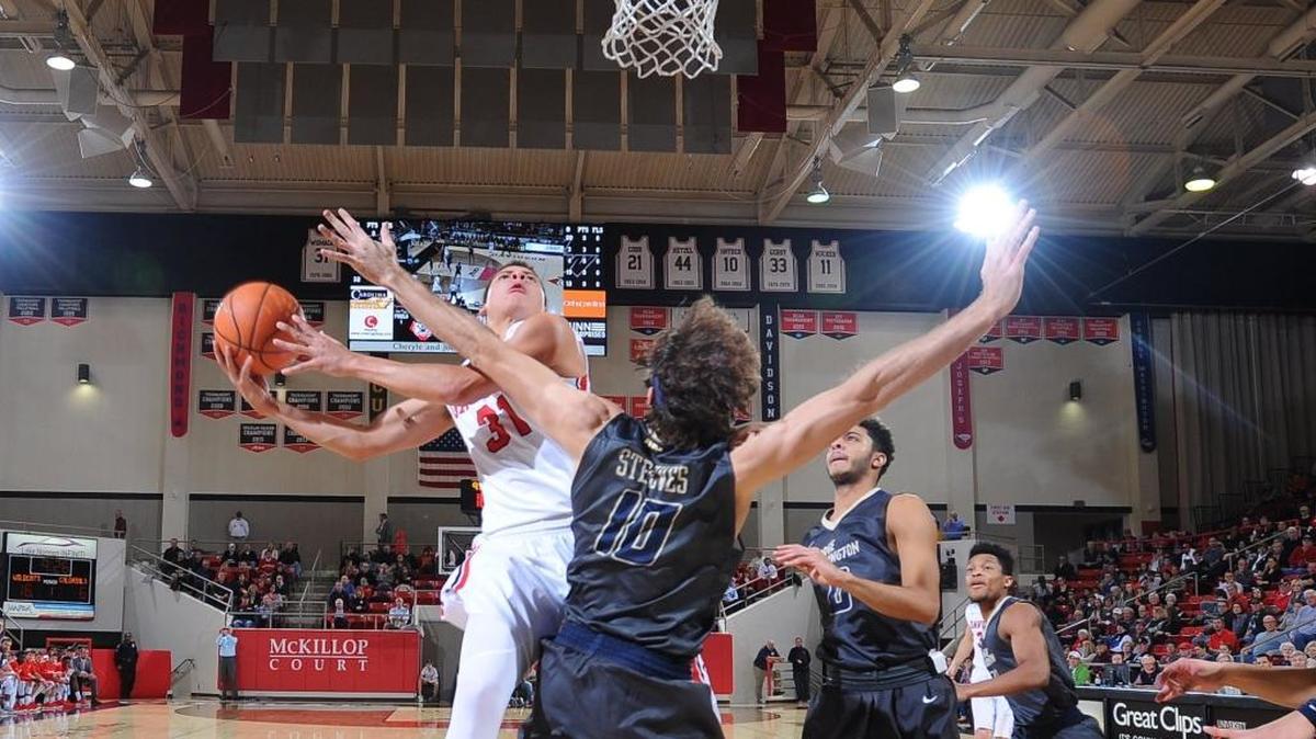Davidson’s Kellan Grady (31) drives to score two against Patrick Steeves (10) of George Washington early in firs- half A-10 men's basketball action at Belk Arena on Wednesday, Jan. 10, 2018 in Davidson. Grady finished with a game-high 19 points as Davidson won 72-45.