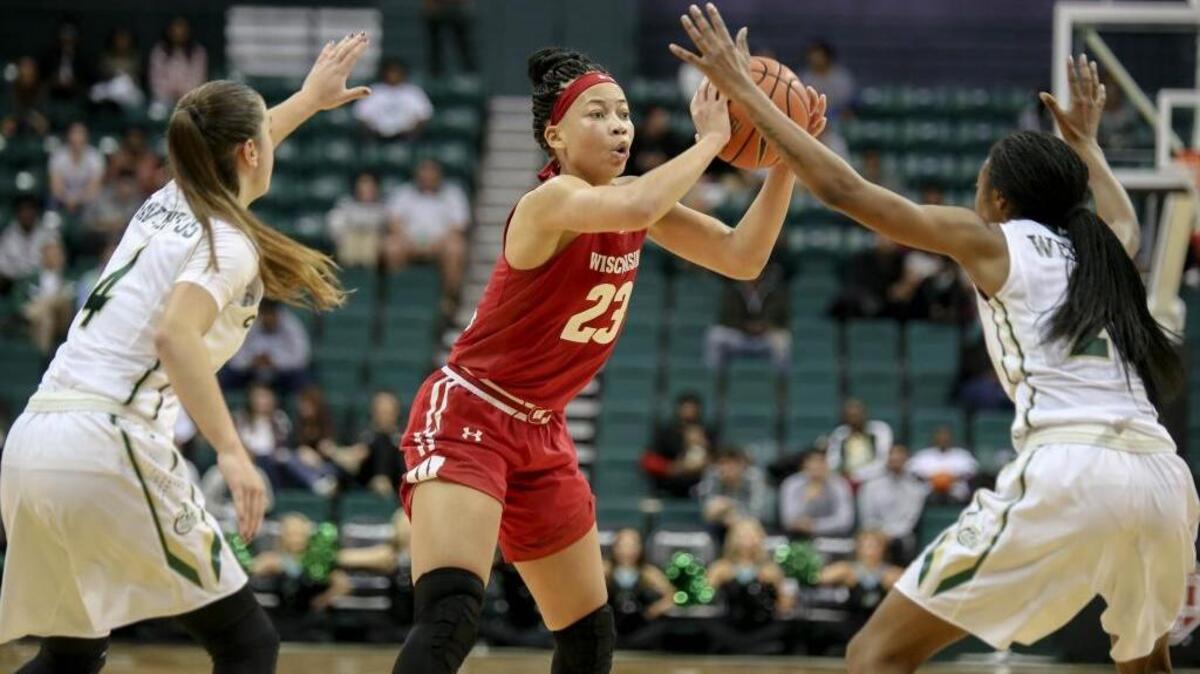 Laia Raventos (4) and Lefty Webster of the 49ers pressure Wisconsin’s Cayla McMorris.