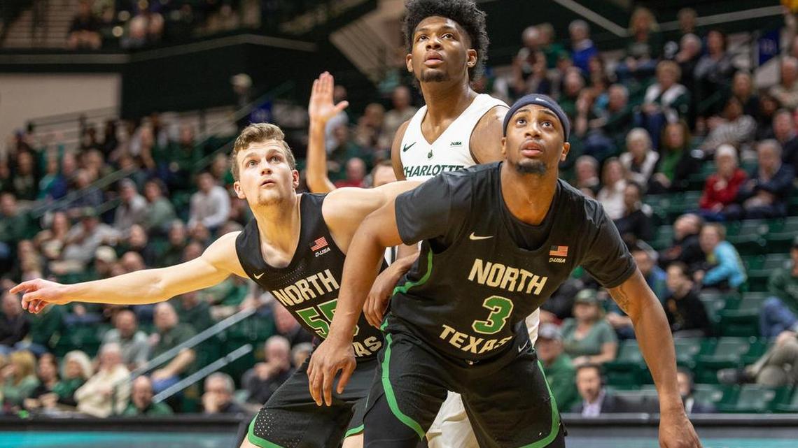 Charlotte 49ers freshman guard Malik Martin (center) is blocked out by North Texas’ DJ Draper, left, and Roosevelt Smart during Saturday’s Conference USA men’s basketball game at Halton Arena. North Texas won 73-66.