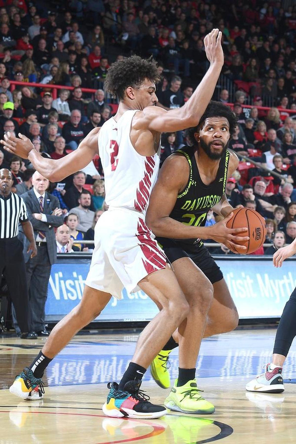 Davidson’s KiShawn Pritchett, right, looks to score against Saint Joseph's Charlie Brown Jr. during Friday’s Atlantic 10 men’s basketball game at Belk Arena. Pritchett scored a career-high 18 points in the Wildcats’ 80-72 victory.