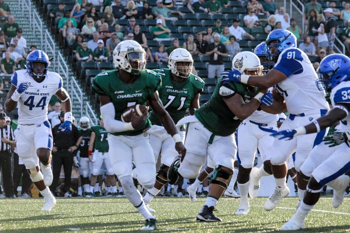 Charlotte 49ers quarterback Hasaan Klugh looks for running room against Georgia State’s defense during Saturday’s game at Richardson Stadium.