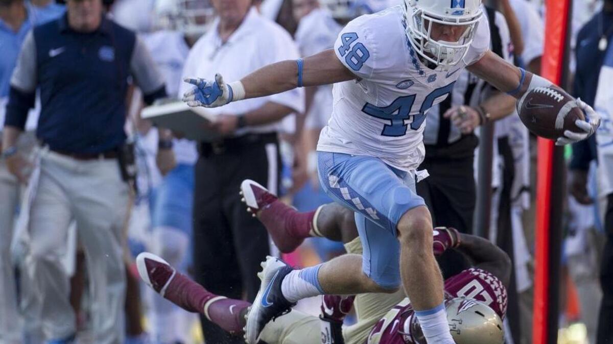 North Carolina receiver Thomas Jackson hurdles Florida State’s Trey Marshall en route to a 34-yard catch from Mitch Trubisky for a fourth-quarter touchdown.