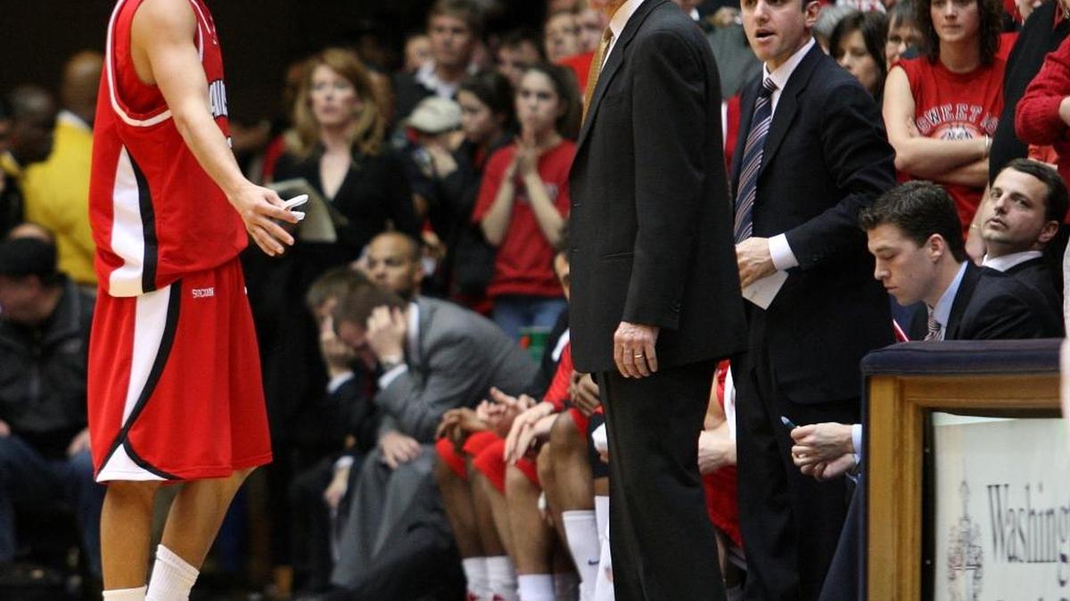 In this picture from the 2008-09 season, longtime Davidson coach Bob McKillop (center) has a word with former All-America guard Stephen Curry as assistant Jim Fox (standing behind McKillop) listens. Fox, now in his third season as coach at Appalachian State, will face his mentor Saturday when the Mountaineers visit for nonconference game at Davidson.