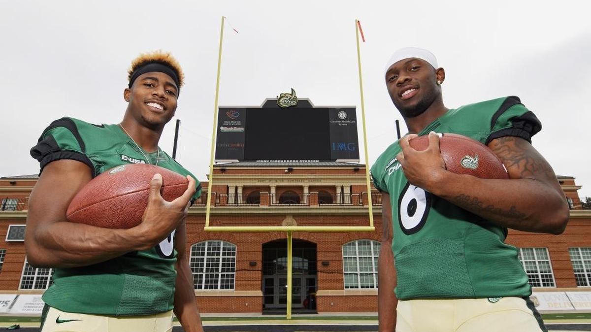 Charlotte 49ers wide receivers Austin Duke (left) and Workpeh Kofa were teammates at Independence High, but weren’t that close. Now that they’re teammates with the 49ers. Duke, a senior, and Kofa, a sophomore, says they’re almost like brothers on and off the field.
