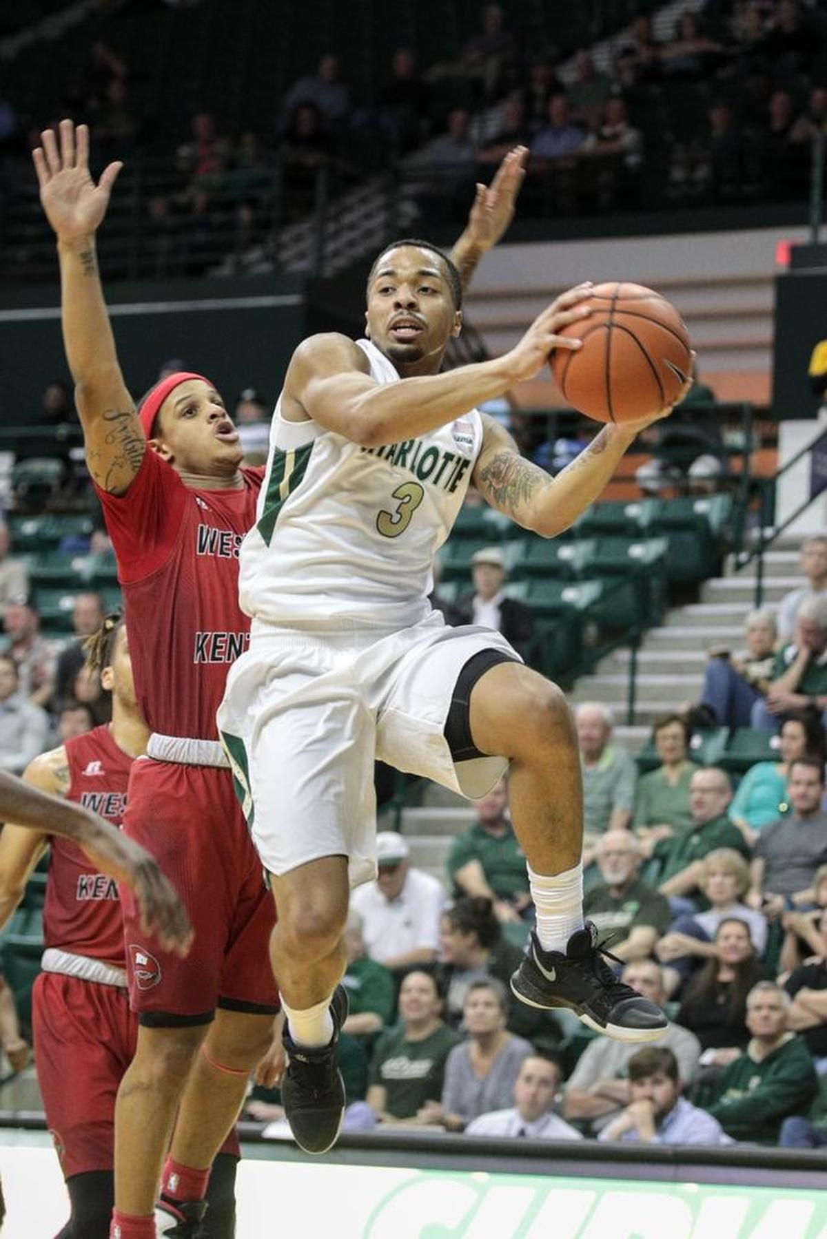 Charlotte junior Jon Davis (right) enters his third season as the 49ers’ starting point guard. He averaged 19.6 points last season to rank second in Conference USA in scoring.