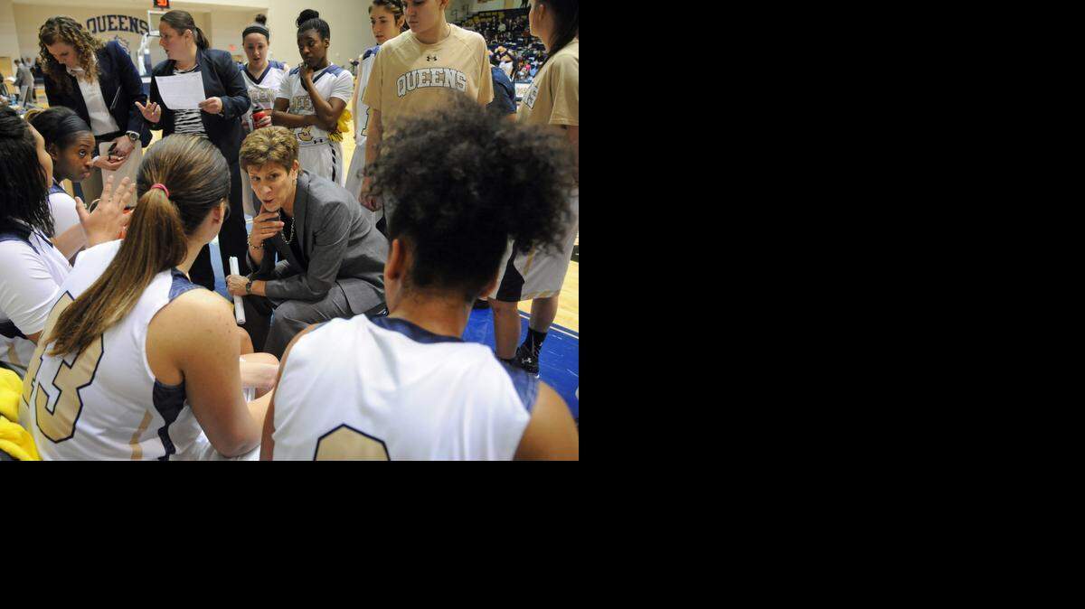 
Queens women’s basketball coach Susan Yow, center, talks with her players during a timeout. Yow saw the Royals finish the 2014-15 season with records of 5-22 overall and 3-18 SAC.
