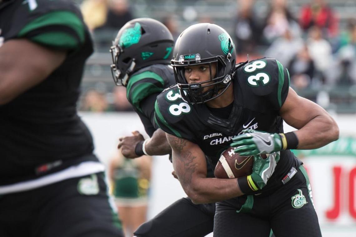 Charlotte 49ers freshman running back Aaron McAllister (38) takes a handoff in the first half Saturday against Florida Atlantic at Richardson Stadium. FAU won 31-12 as Charlotte (1-11, 1-7 C-USA) closed out its season on Nov. 25, 2017.