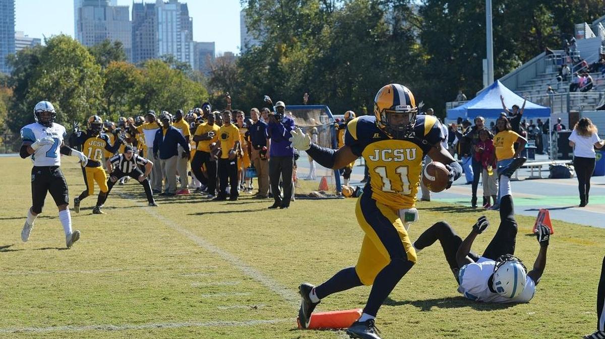 Gabriel Yuille scores J.C. Smith's first touchdown against Livingstone on a 23-yard pass from quarterback Harold Herbin just before halftime. The Golden Bulls went to beat the Bears 30-8 in the eighth Commemorative Classic.