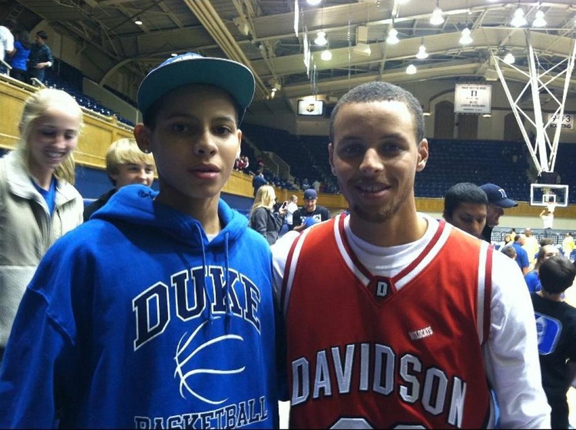 Kellan Grady, left, and Stephen Curry met for the first time at a Duke game in 2011. This chance meeting helped bring Grady to Davidson.