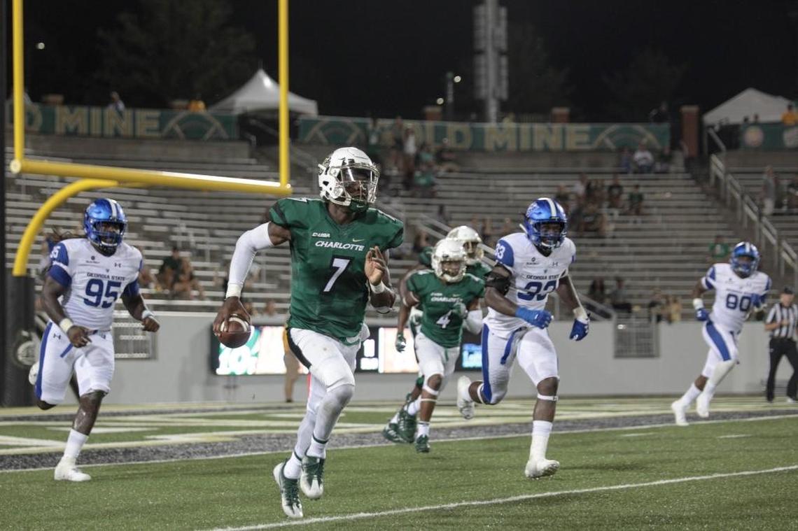 Charlotte 49ers quarterback Hasaan Klugh (7) heads upfield against Georgia State in Saturday’s college football game at Richardson Stadium.