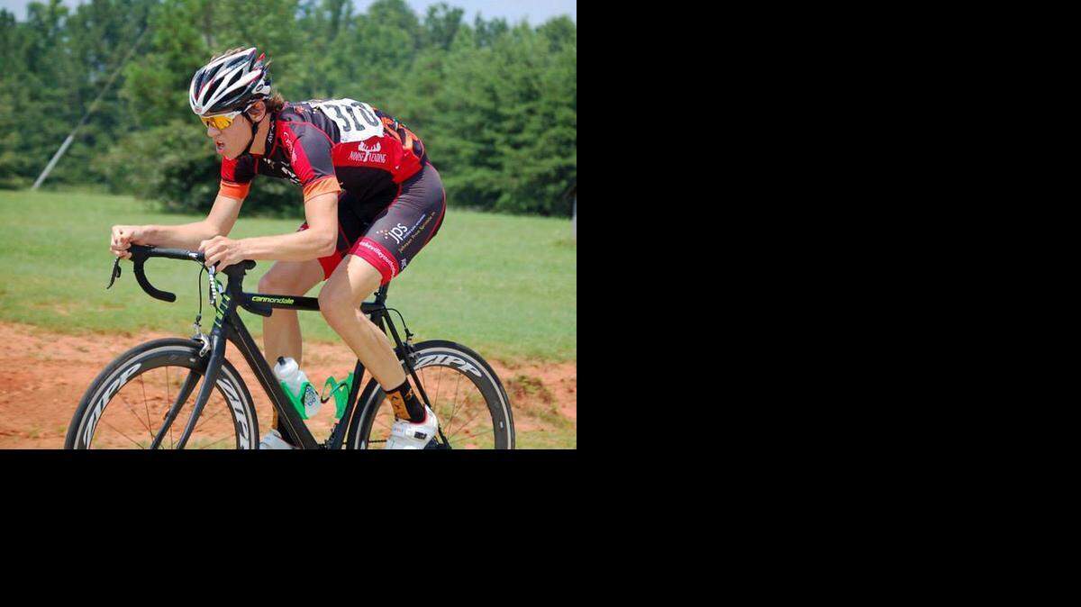 
East Mecklenburg High senior Andrew Fairman competes in a cross country bicycle race last year. Fairman, a senior, is the first signee by Queens’ new triathlon program, which begins competition in the fall of 2015. 
