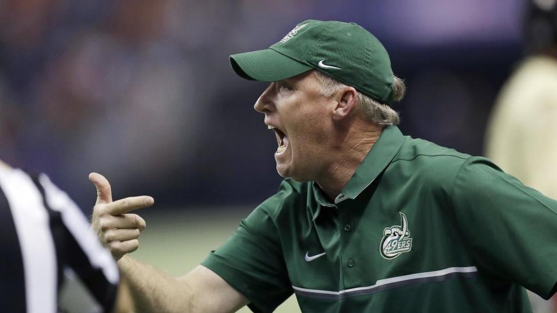 Charlotte 49ers coach Brad Lambert argues a call during the first half of Saturday night’s Conference USA football game at Texas-San Antonio. The Roadrunners won 33-14 to become bowl eligible.