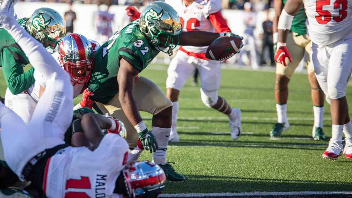New Charlotte 49ers running back coach Sean Dawkins will coach Benny LeMay (32), one of Conference USA’s top rushers last season.