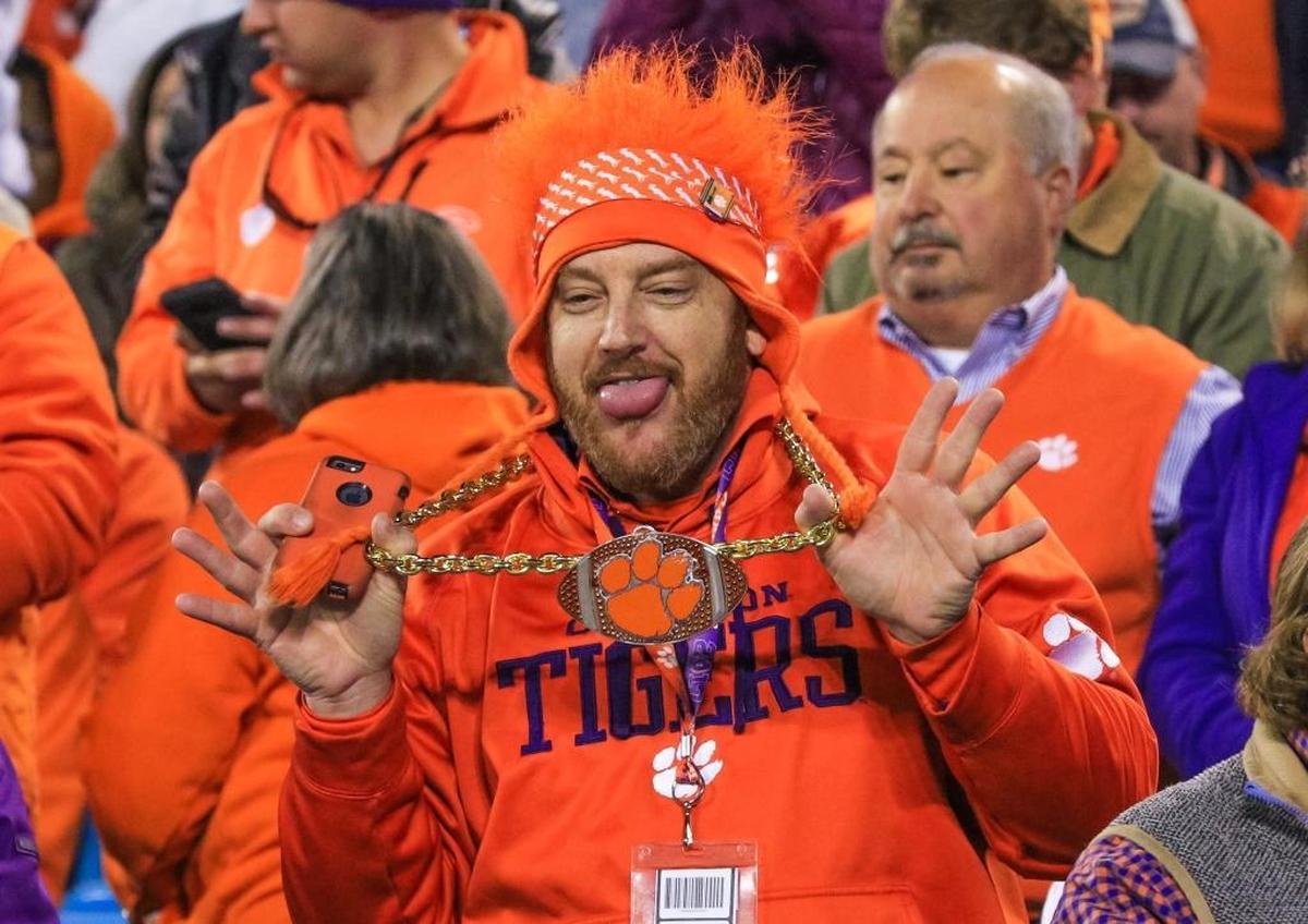 Clemson fan Shane Moore of Greenville, S.C., shows of his chain during of the first half of the ACC Championship Game in Charlotte on Saturday.