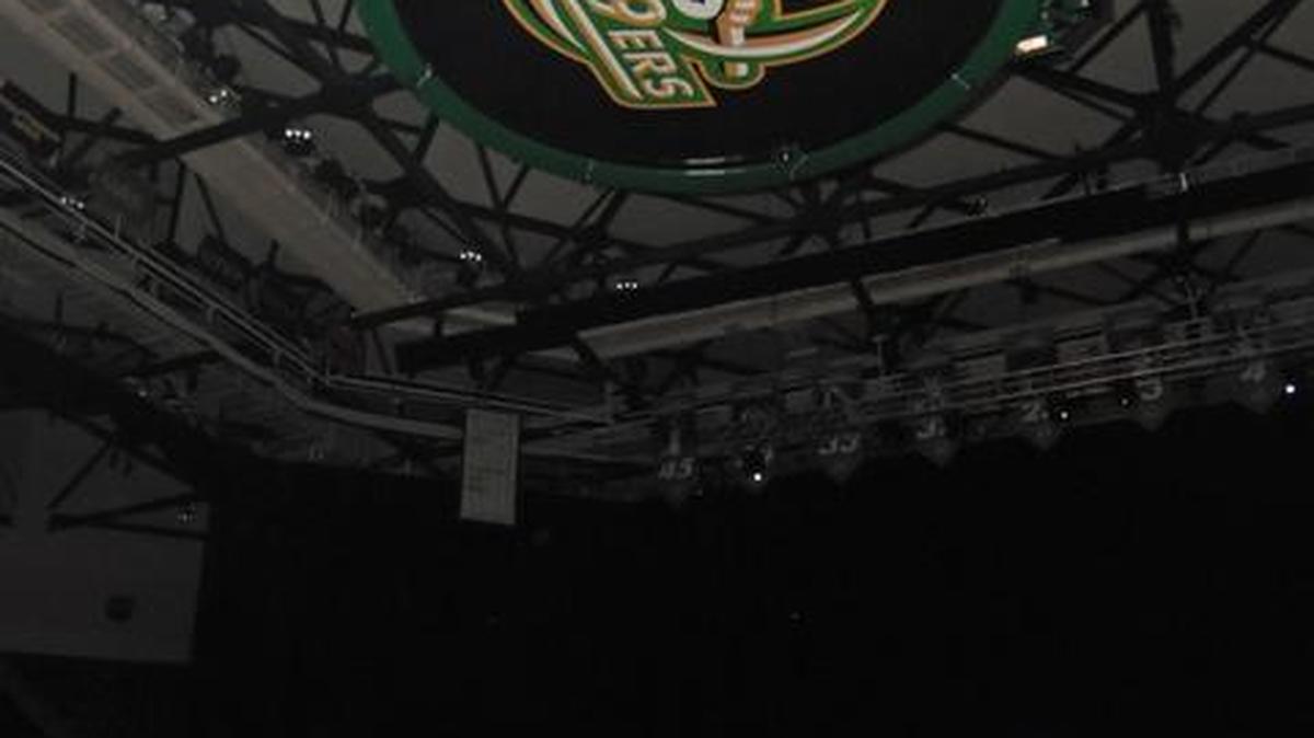 Charlotte 49ers men’s basketball coach Mark Price talks to the crowd under the new scoreboard at Halton Arena during the annual Basketball Madness on Thursday.