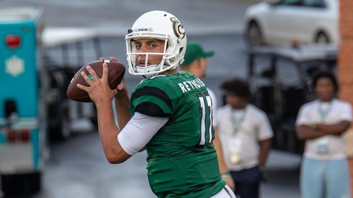 Charlotte 49ers redshirt freshman quarterback Chris Reynolds warms up before Saturday night’s football game against Fordham. He completed 13-of-20 passes for 267 yards and a touchdown in the 49ers’ 34-10 win at Richardson Stadium.　