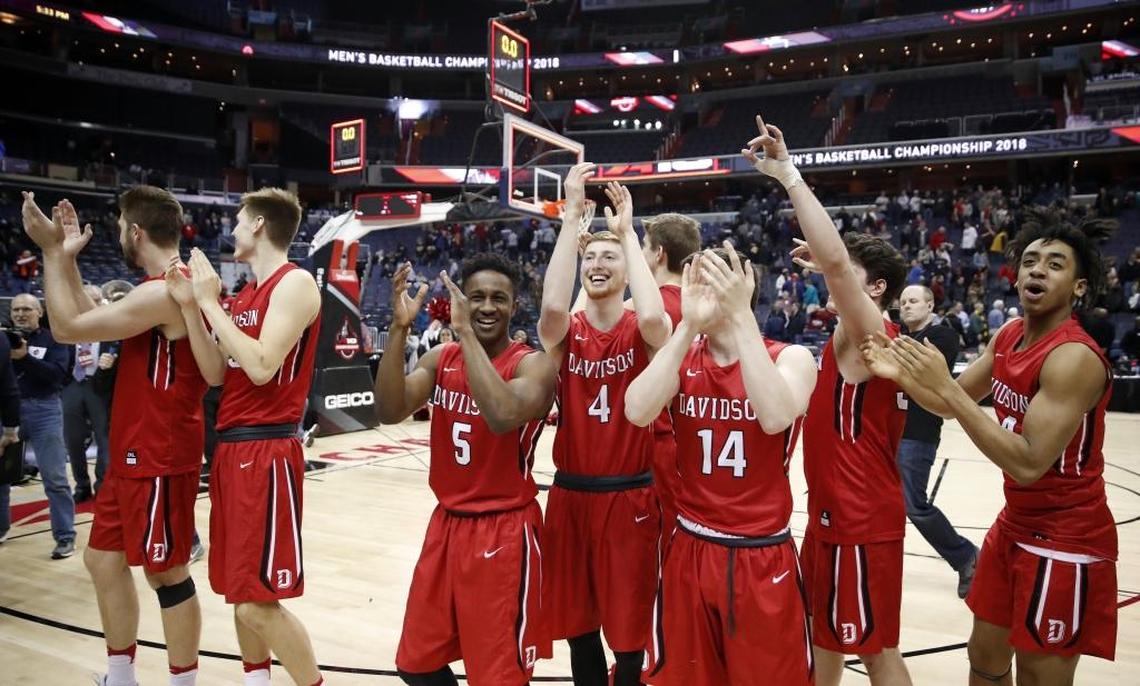 Members of the Davidson team cheer the fans after Saturday’s Atlantic 10 Conference tournament game in Washington. Davidson beat St. Bonaventure, 82-70 to advance to the finals, where they will face Rhode Island on Sunday.