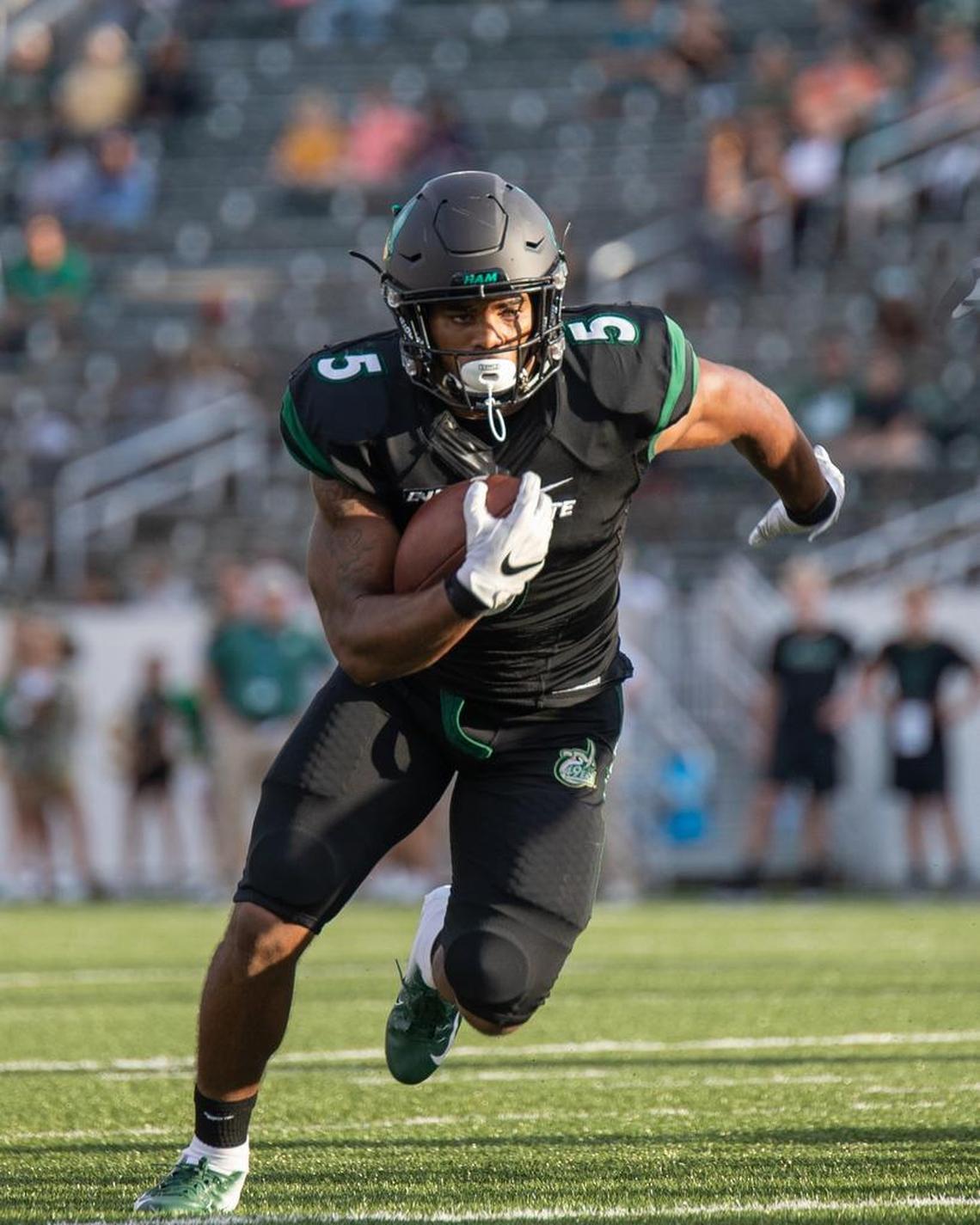 Running back Aaron McAllister races toward the end zone for a 14-yard touchdown, giving the Charlotte 49ers a 28-18 lead over Old Dominion in the fourth quarter of Thursday’s Conference USA football opener at Richardson Stadium.