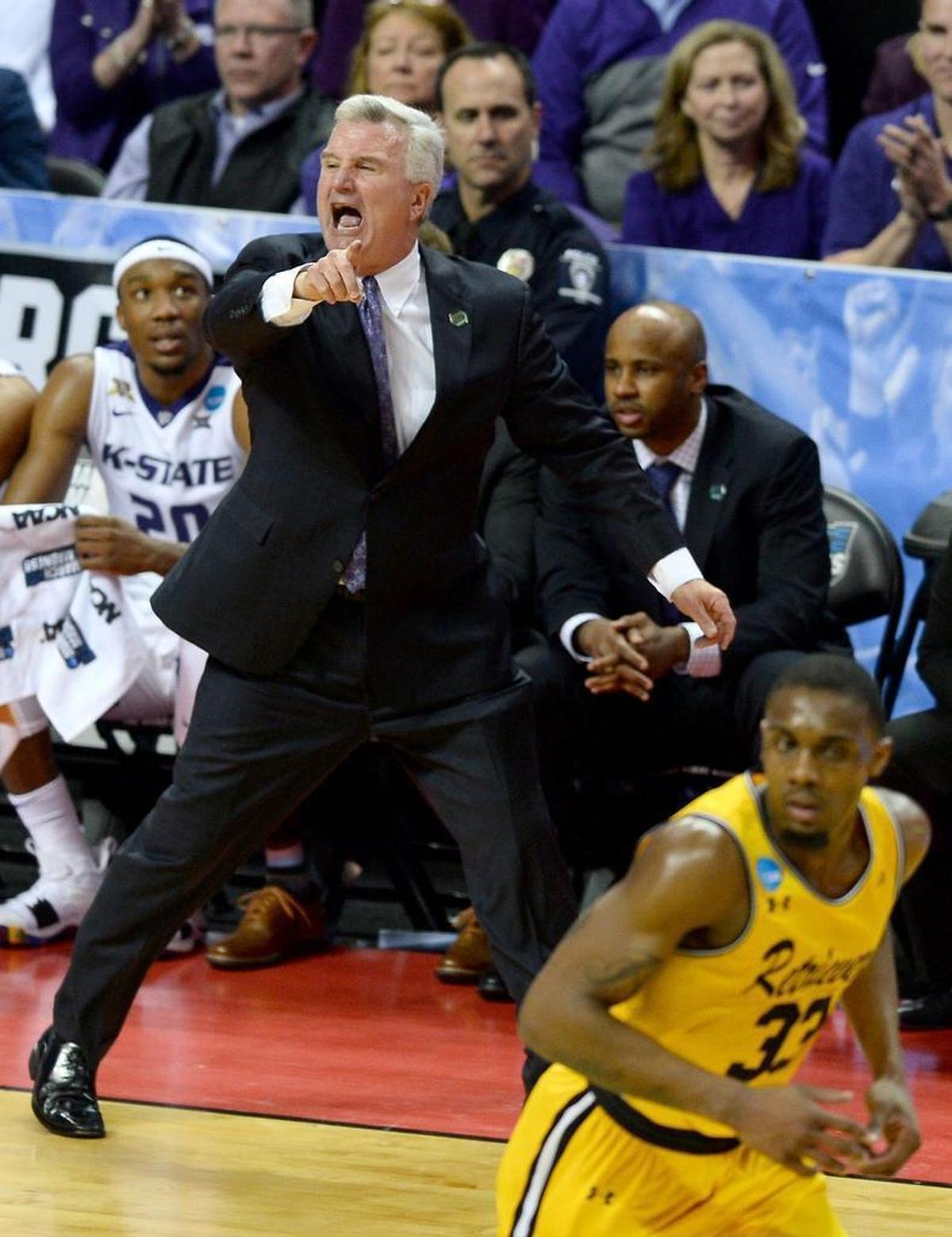 Kansas State coach Bruce Weber yells instructions to his team as they battle the UMBC Retrievers during Sunday’s second-round NCAA tournament game at the Spectrum Center.