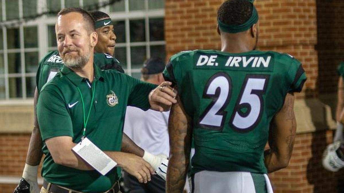 New Charlotte athletics director Mike Hill, pictured last Saturday following the 49ers’ win against Fordham, said an annual football game between his school and Appalachian State would be great for the region. The teams will meet for the first time on Saturday at Richardson Stadium.