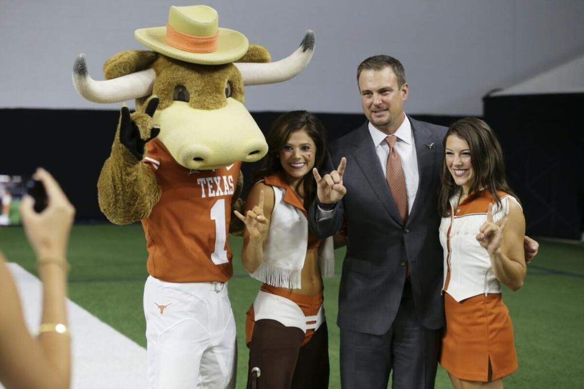 Tom Herman, second from right, is the successor the Longhorns have needed since Mack Brown’s retirement late in 2013.