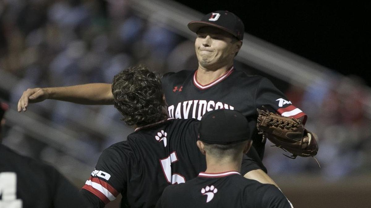 Davidson closing pitcher Allen Berry (42) celebrates with teammates Brett Centracchio (5) and Dan Spear (22) after Friday’s 8-4 upset of No. 2 overall seed North Carolina in an NCAA regional baseball game in Chapel Hill.