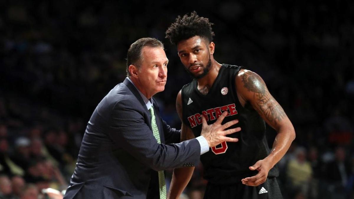 N.C. State basketball coach talks strategy with guard Terry Henderson in the first half of Tuesday’s ACC game at Georgia Tech. Henderson scored 21 in the Wolfpack’s 71-69 victory.