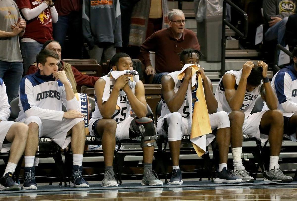 The Queens bench reacts near the end of Thursday night’s semifinal game in the NCAA Division II Men's Basketball Championship tournament at the Sanford Pentagon in Sioux Falls, South Dakota. The Royals fell 105-99 in two overtimes.