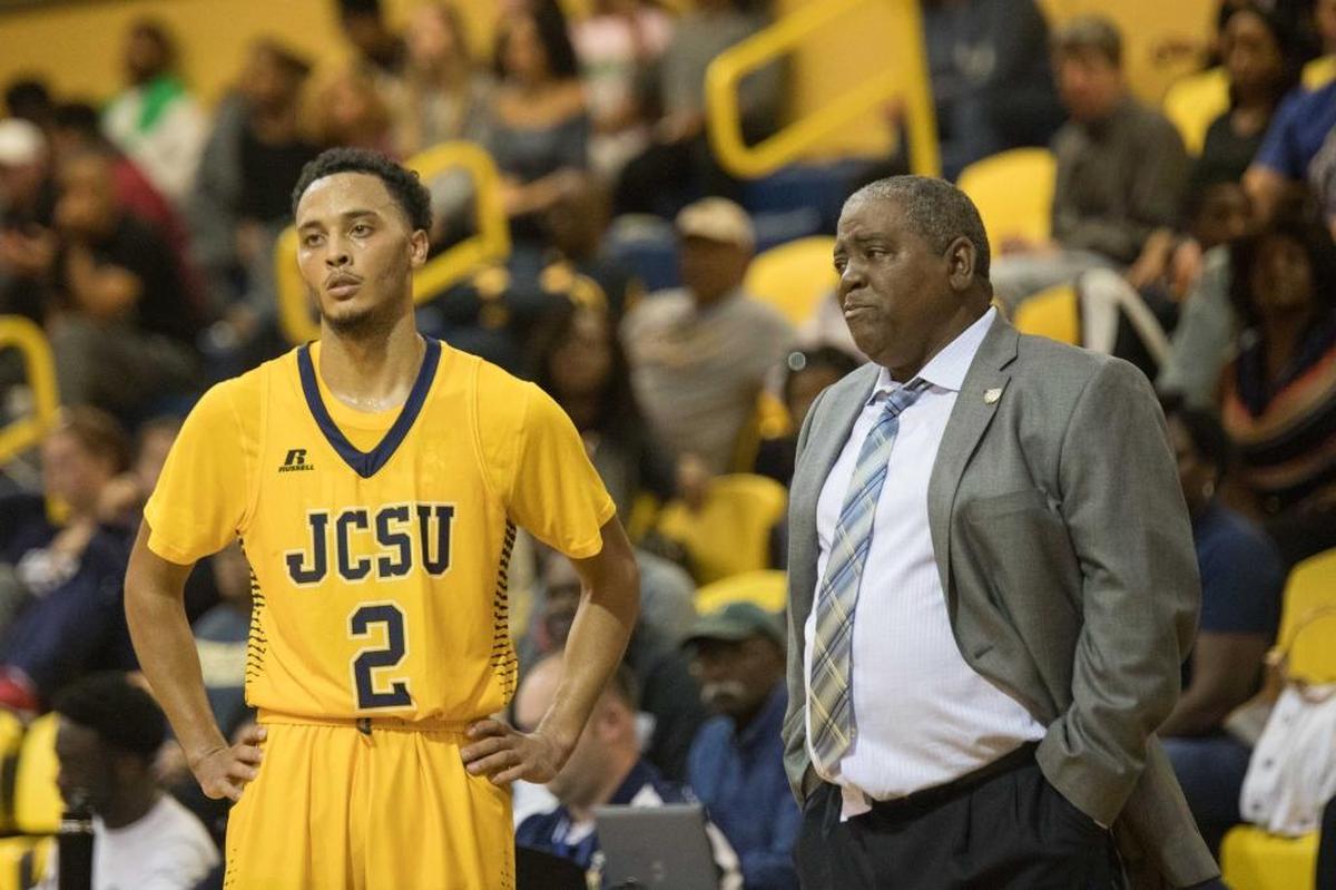 J.C. Smith guard Christian Kirchman, left, and Golden Bulls coach Steve Joyner talk strategy in 2017.