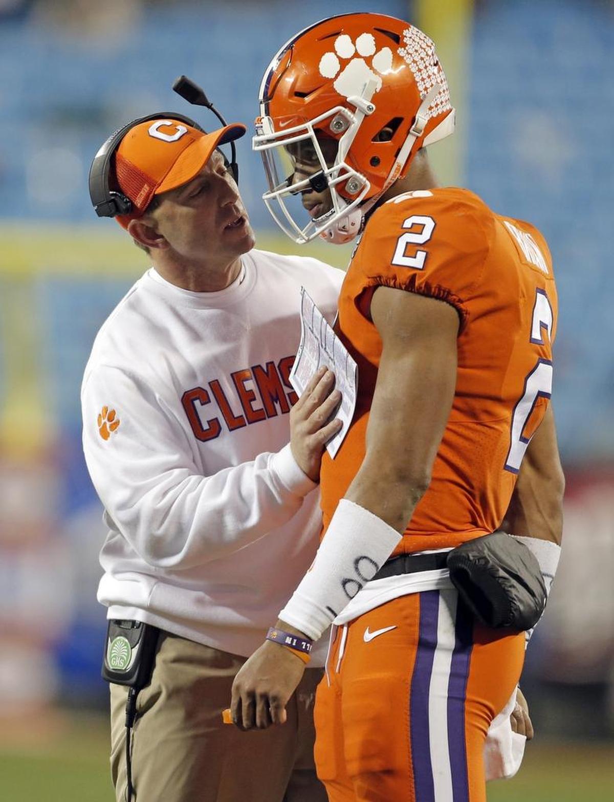 Clemson coach Dabo Swinney, left, told quarterback Kelly Bryant to be himself, not to feel pressure to live up to Deshaun Watson’s legacy.