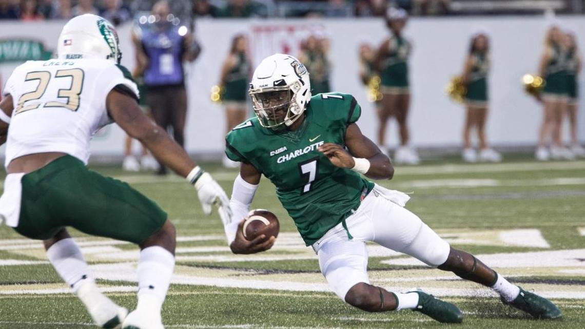 Charlotte 49ers quarterback Hasaan Klugh (7) slides for yardage against the Ala.-Birmingham Blazers at Jerry Richardson Stadium. Klugh’s two-point conversion reception in overtime provided the game-winning points on Saturday.