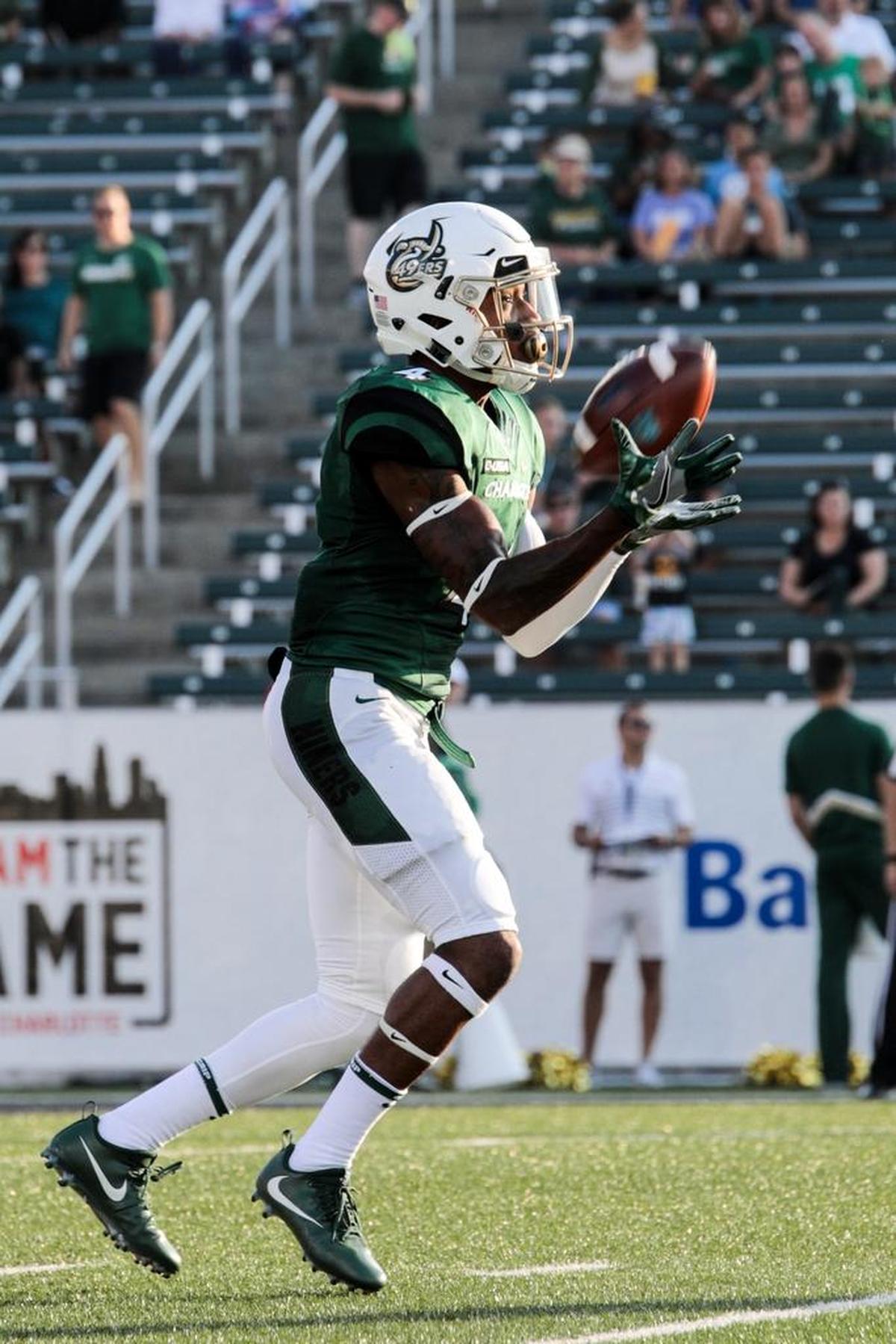 Charlotte 49ers senior Chris Montgomery clutches the opening kickoff against visiting Georgia State in Saturday’s game.