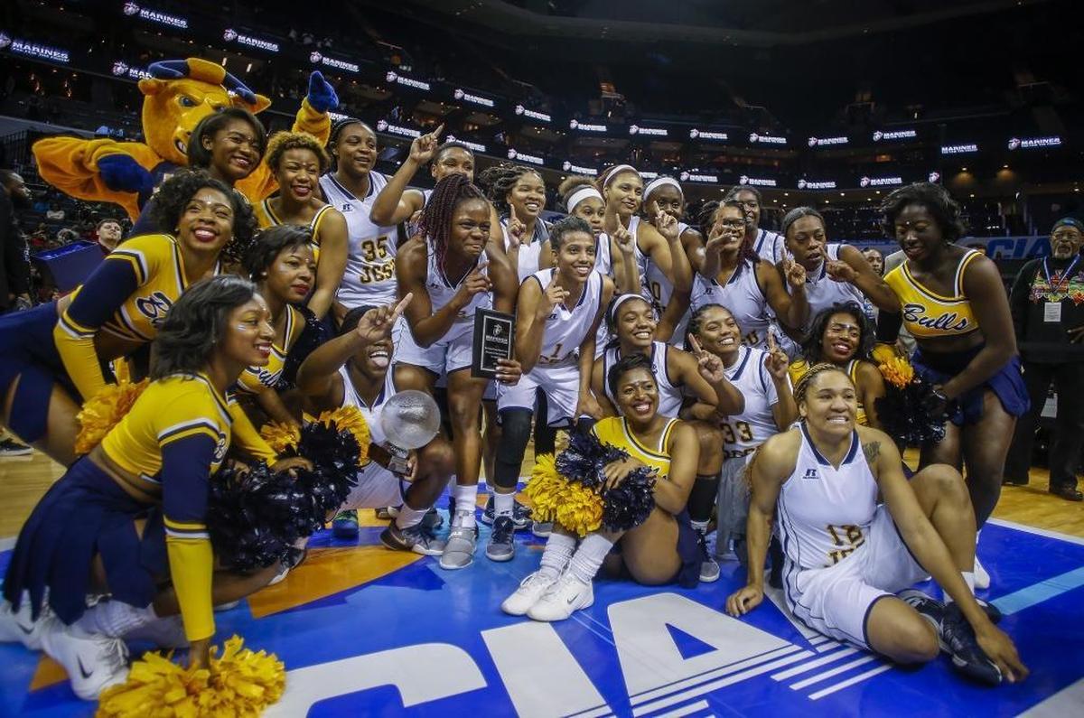 Johnson C. Smith players and cheerleaders celebrate their win over Virginia State in the 2017 women's CIAA basketball championship at the Spectrum Center.