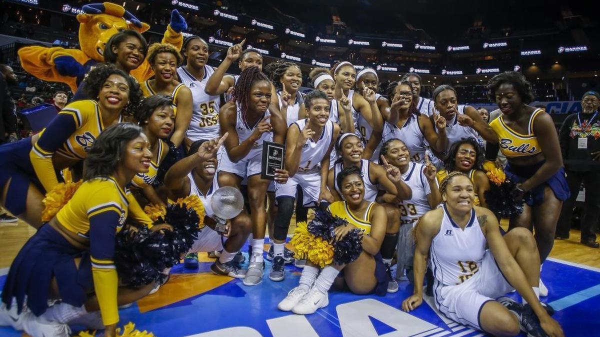Johnson C. Smith players and cheerleaders celebrate their win over Virginia State in the women's CIAA basketball championship at the Spectrum Center.