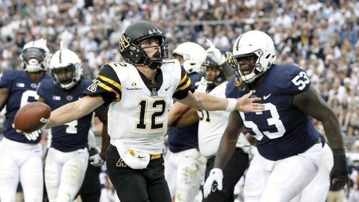 Appalachian State quarterback Zac Thomas (12) scores a touchdown against Penn State in the second half of Saturday’s college football game in State College, Pa. Thomas and the Mountaineers will visit the Charlotte 49ers this weekend.
