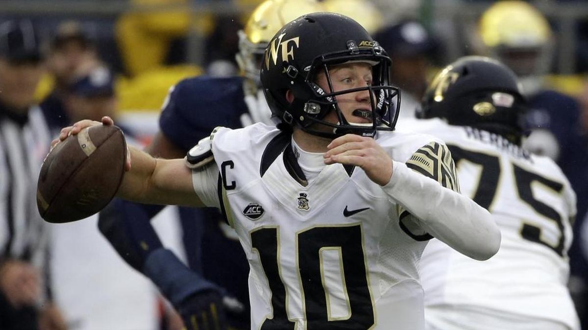 Wake Forest quarterback John Wolford looks to pass against Notre Dame during the first half of Saturday’s game in South Bend, Ind.
