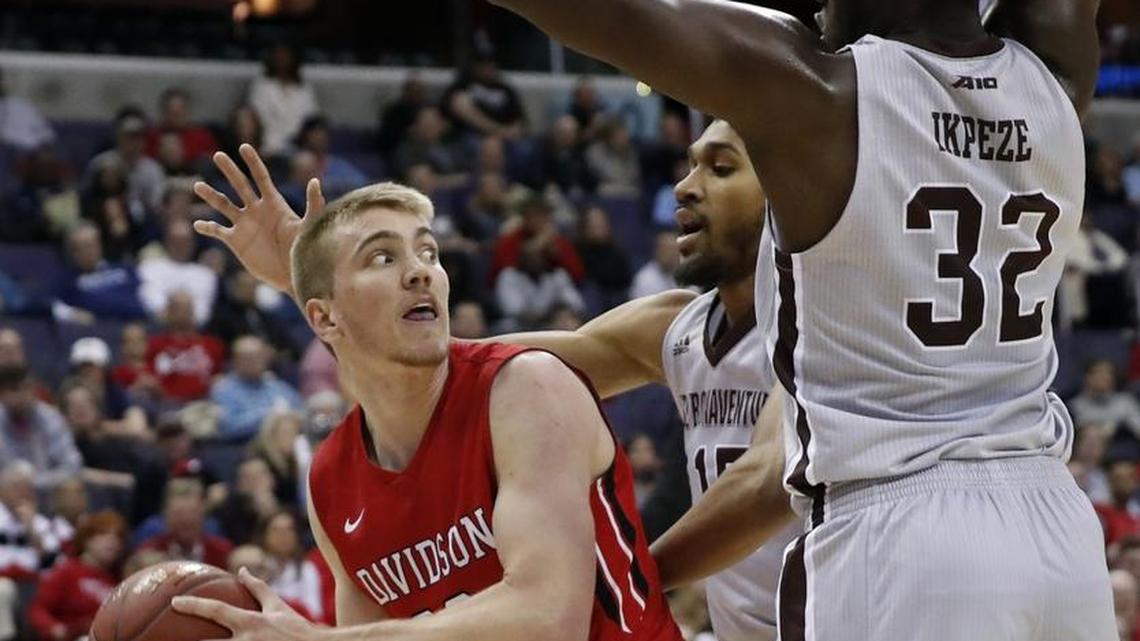 Davidson forward Peyton Aldridge, left, looks to pass in Saturday’s Atlantic 10 Conference tournament game, an 82-70 win against St. Bonaventure. Aldridge finished with a game-high 24 points and added seven rebounds to lead the Wildcats into the tournament championship game.