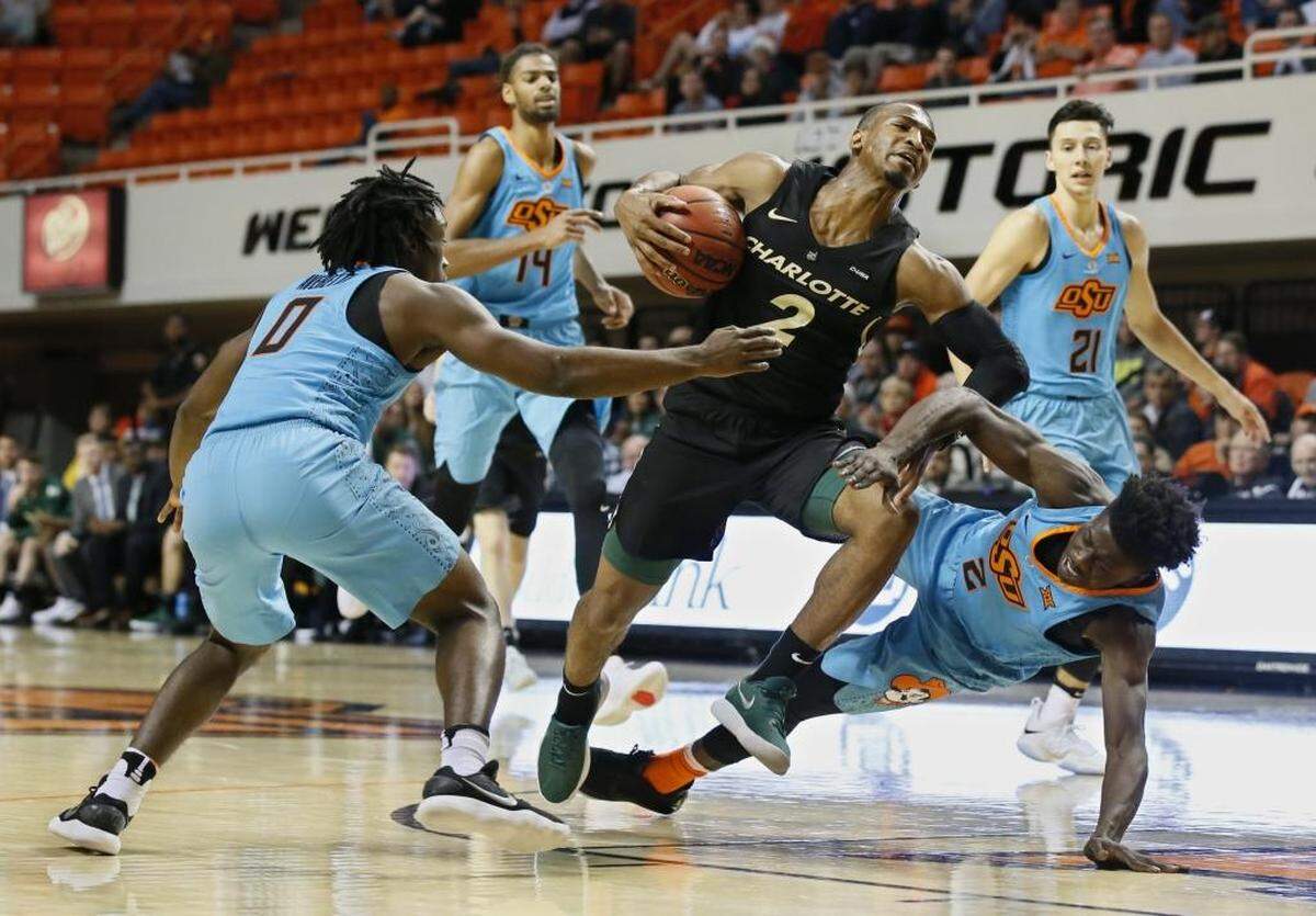 Charlotte guard Andrien White (2) scored a team-high 18 points and was the only 49ers player able to crack the Oklahoma State defense.
