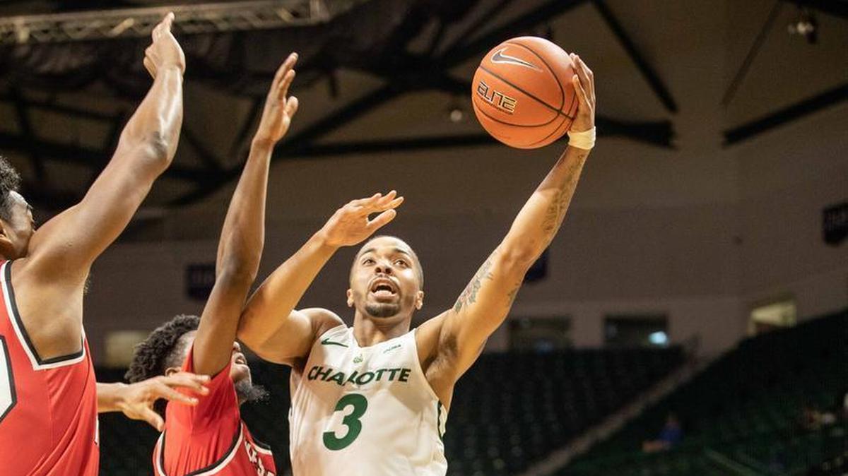 Charlotte 49ers point guard Jon Davis, right, scored 16 of his team’s 23 first-half points against Western Kentucky on Thursday at Halton Arena.