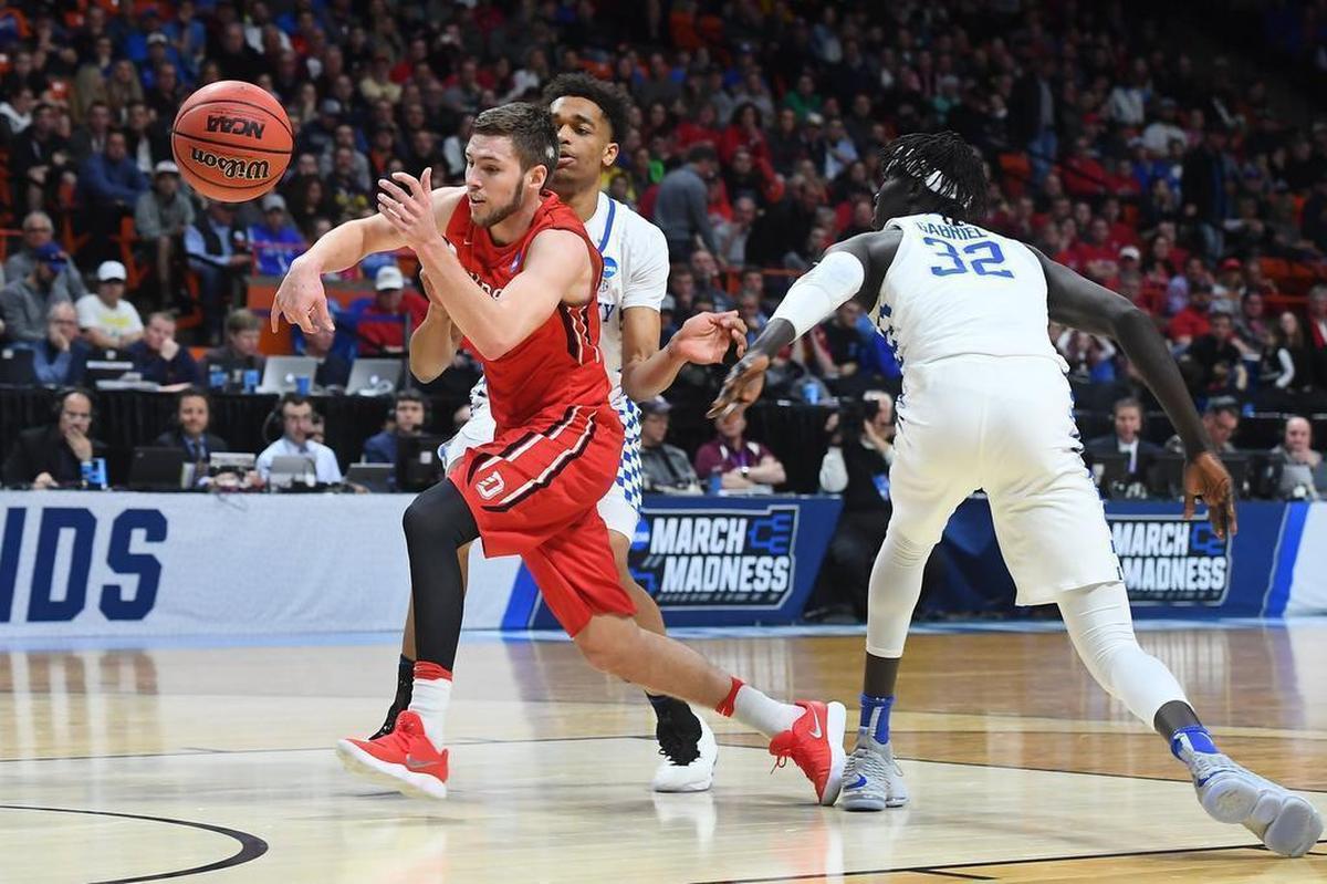 Davidson’s Jon Axel Gudmundsson (03) is fouled going to the basket by Kentucky’s Wenyen Gabriel (32) late in the first half of Thursday’s NCAA men’s basketball tournament game in Boise, Idaho. Gudmundsson finished with 21 points.