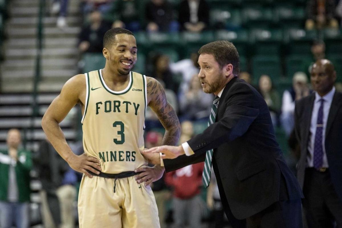 Charlotte 49ers guard Jon Davis reacts to interim head coach Houston Fancher during Saturday’s game. Charlotte beat Florida Atlantic 85-78 Saturday at Halton Arena, snapping a 15-game losing streak, in its season finale.