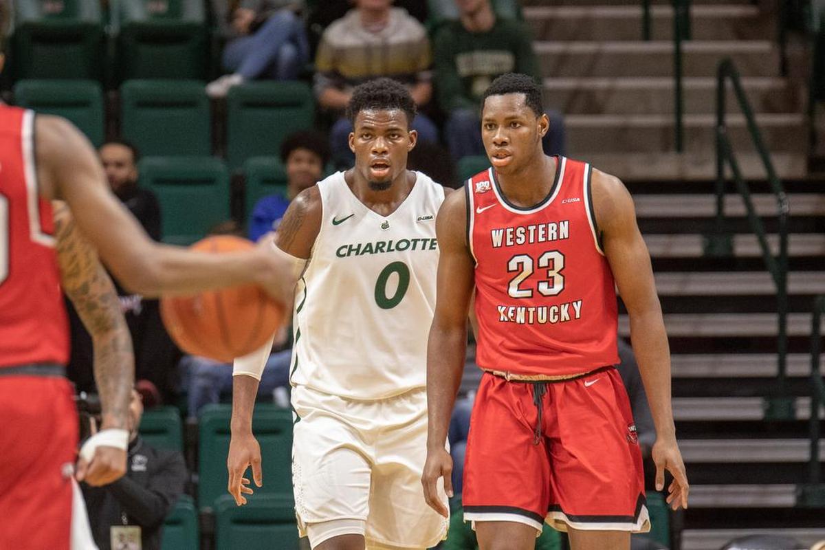 Charlotte 49ers senior center Jailen Haslem (0) and Western Kentucky’s Charles Bassy (23) during Thursday’s Conference USA men’s basketball game at Halton Arena.