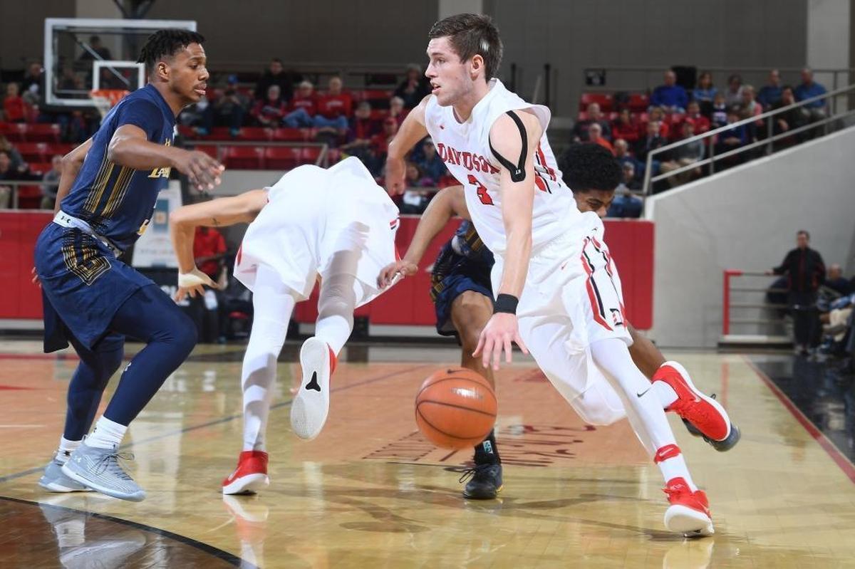 Davidson’s Jon Axel Gudmundsson (03) drives against La Salle's Tony Washington (05) late in the first half of Wednesday’s Atlantic 10 game at Belk Arena. The Wildcats won, 84-65.