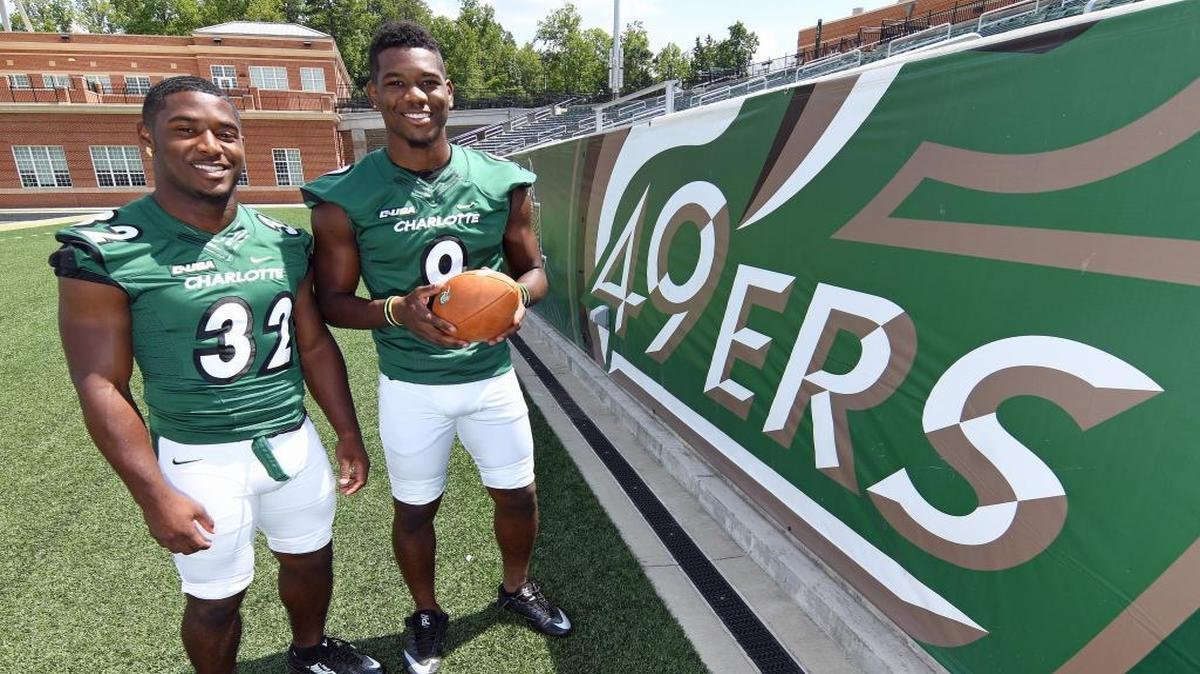 Freshman running back Benjamin LeMay, left, and brother Uriah, a redshirt junior wide receiver, are among three sets of brothers on the Charlotte 49ers’ roster this season. The LeMays last played together in 2012 as members of the Butler High Bulldogs’ team.