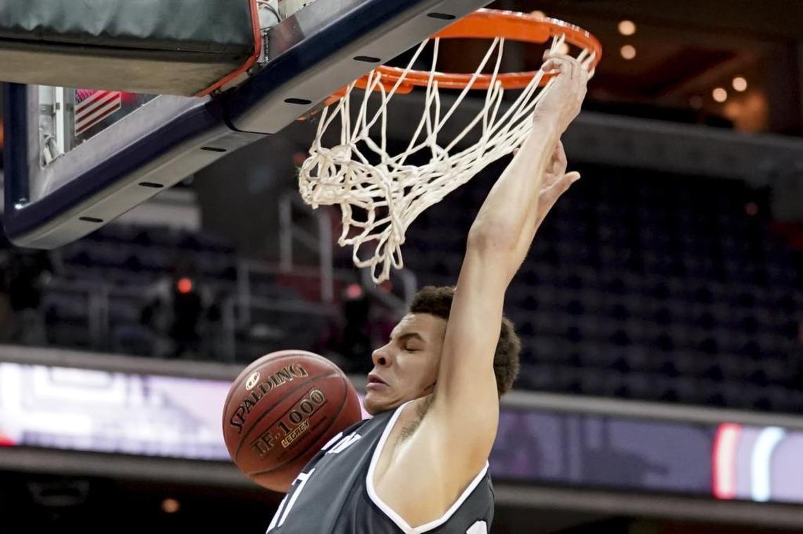 Davidson guard Kellan Grady (31) dunks during the first half of Sunday’s Atlantic 10 Conference tournament championship game against Rhode Island in Washington. Grady scored 17 points as the Wildcats stunned the top-seeded Rams 58-57 to win the A-10 title and an automatic NCAA Tournament bid.