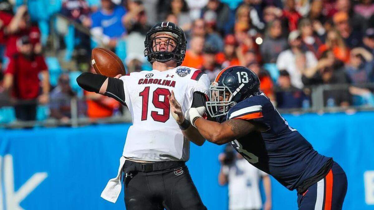 South Carolina quarterback Jake Bentley (19) is pressured by Virginia linebacker Chris Peace (13) during the first half of the Belk Bowl in Charlotte, NC, Saturday, December 29, 2018.