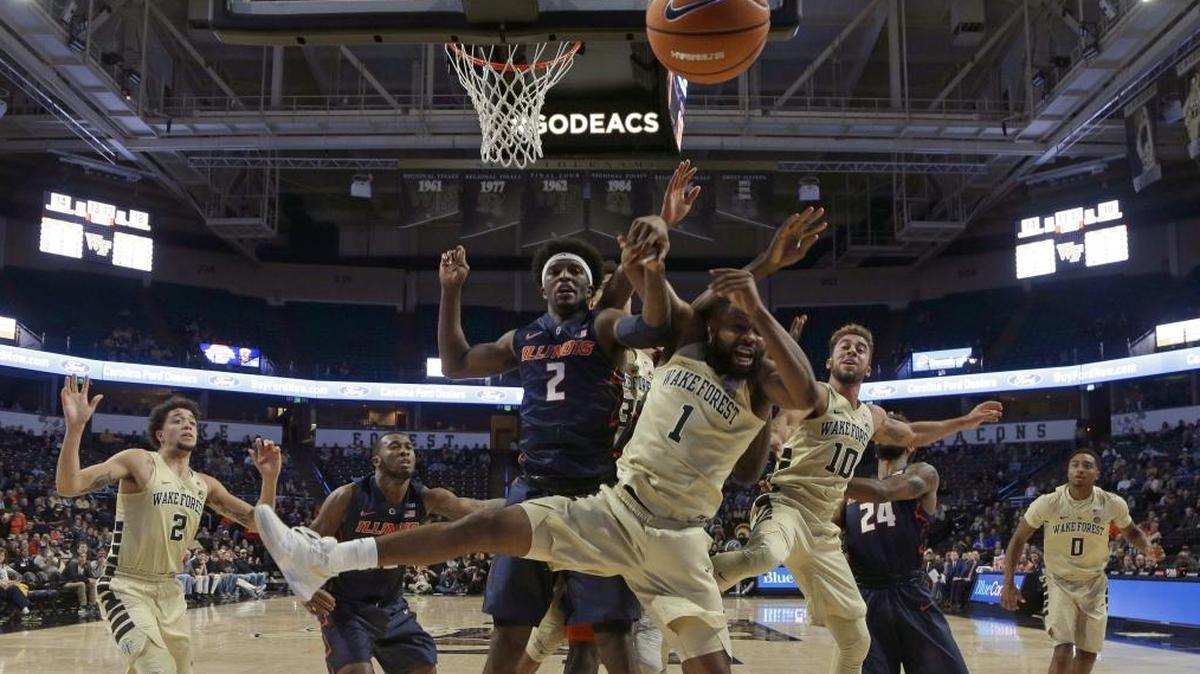 Wake Forest’s Keyshawn Woods (1) and Illinois’ Kipper Nichols (2) battle for a rebound during the first half of their November game in Winston-Salem.