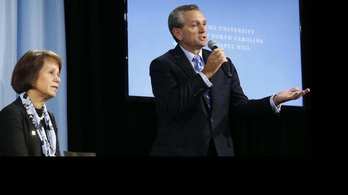 
UNC athletic director Bubba Cunningham speaks at a press conference as UNC chancellor Carol Folt looks on after a presentation of the Wainstein report, an investigation into academic fraud at UNC on October 22, 2014. 
